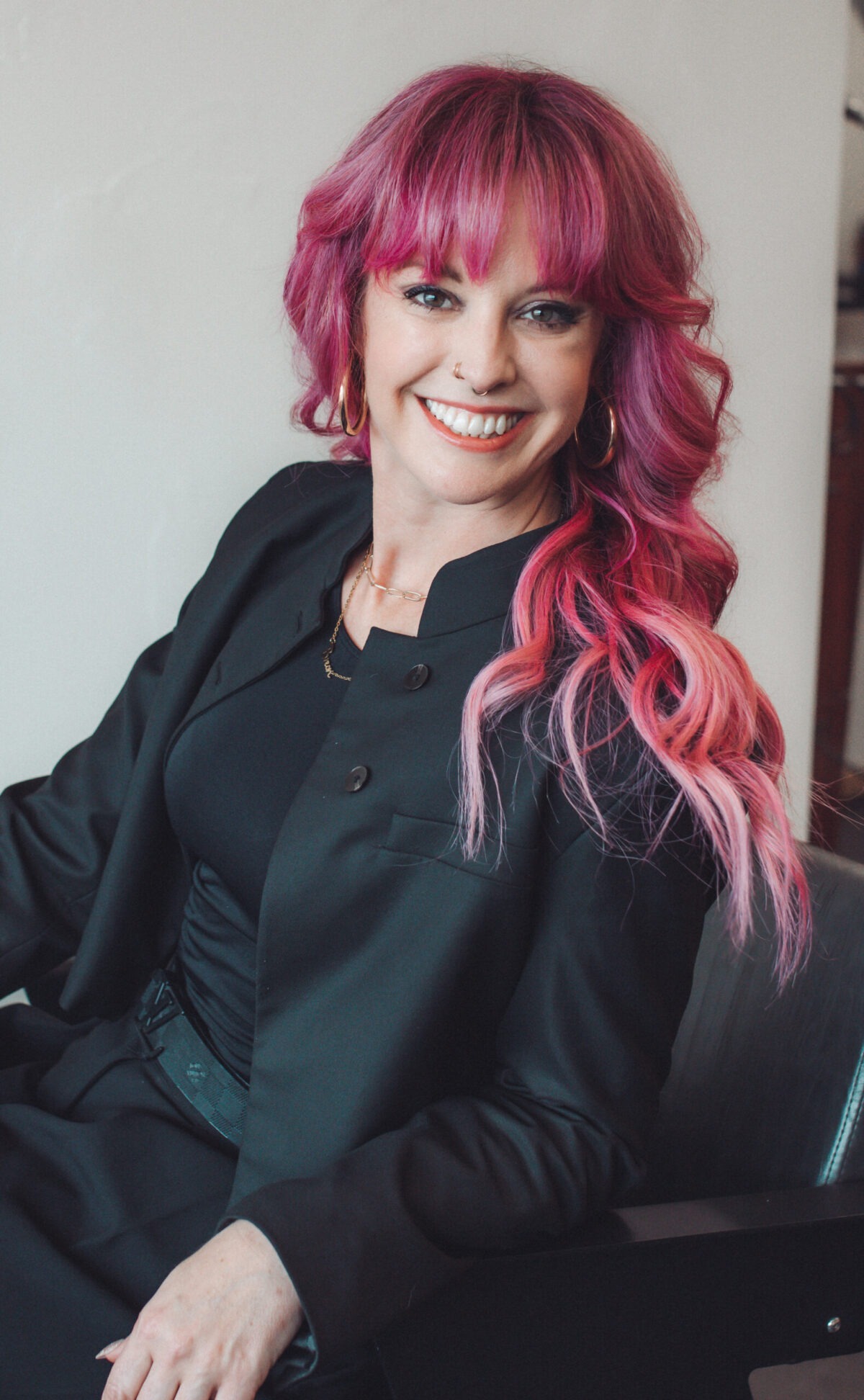 Bre McCoy, Master Stylist here at Lockworx Lansing Hair Salon